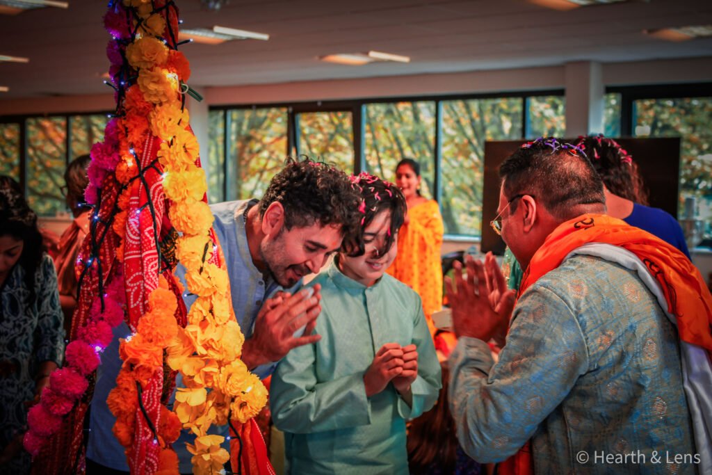 Guruji offering blessings to attendees during the Janmashtami celebration at Dharma Mandir Newport.