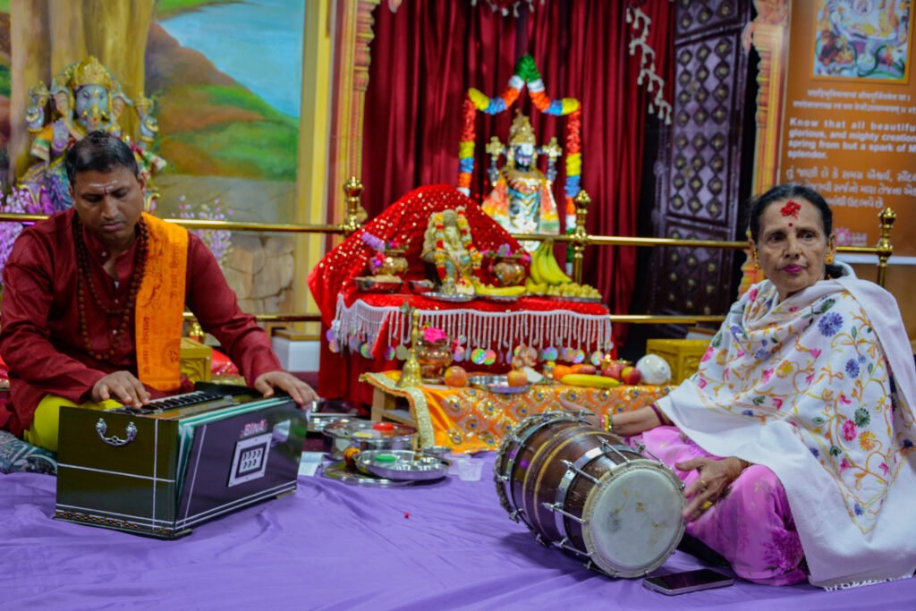 Members of the Cardiff community singing bhajans during Ganesh Chaturthi