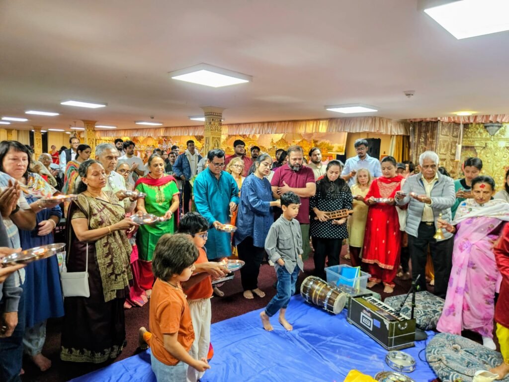 Community gathering for Samuhik Aarti during Ganesh Chaturthi in Cardiff
