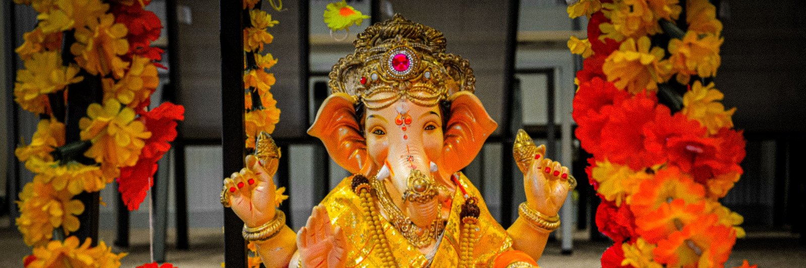 Ganesh murti decorated with flowers during Ganesh Chaturthi celebrations in Newport, Wales