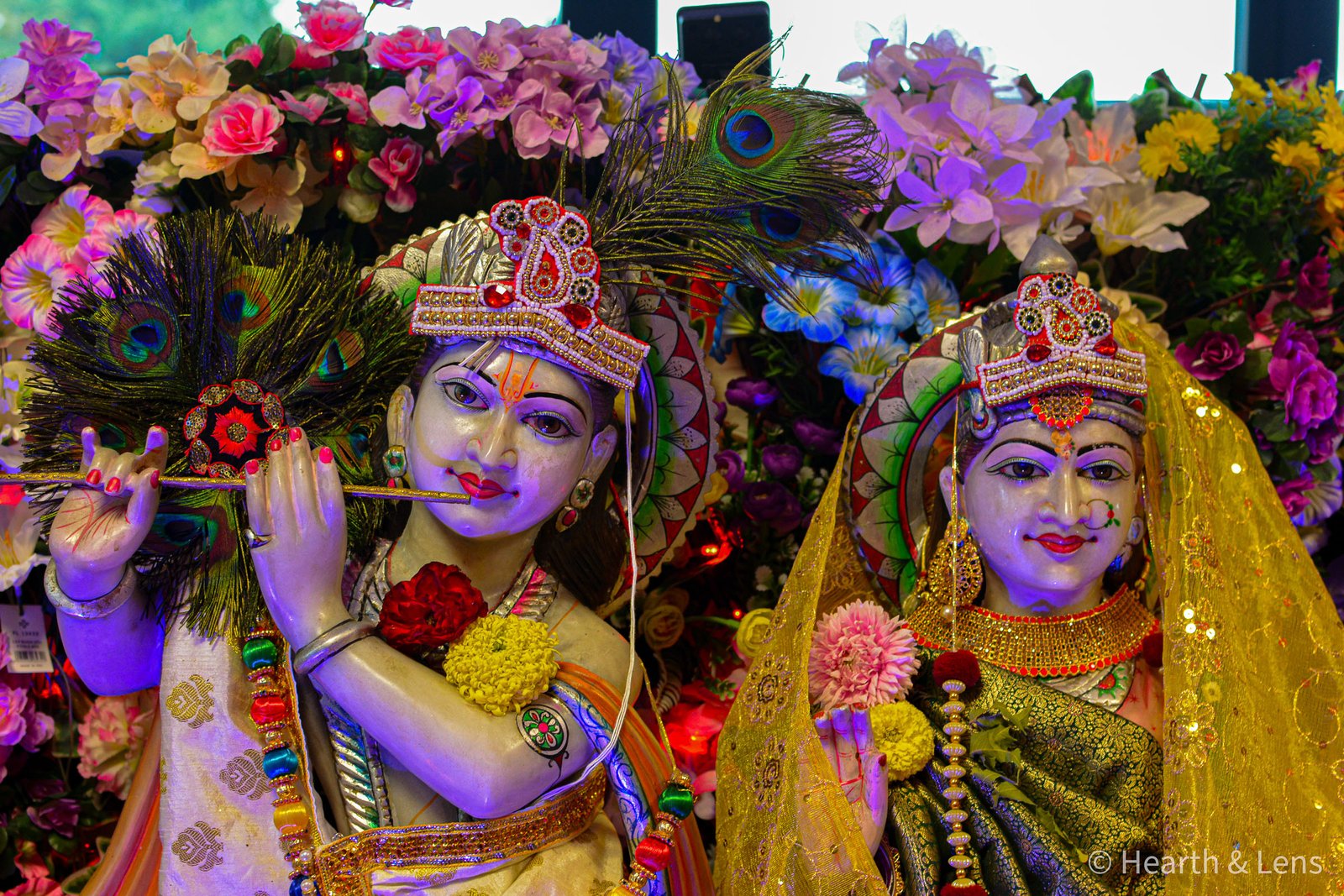 Decorated statues of Radha and Krishna during the Janmashtami celebration at Dharma Mandir Newport.